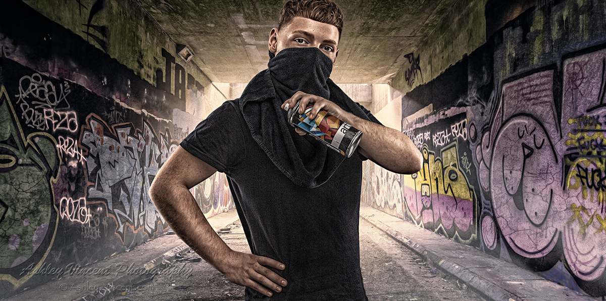 composite of a masked man holding a spray can standing in a graffiti-filled tunnel by photographer Ashley Vincent