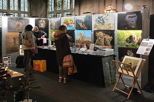 customers engaging with wildlife photographer ashley vincent at his stand in Haddon Hall