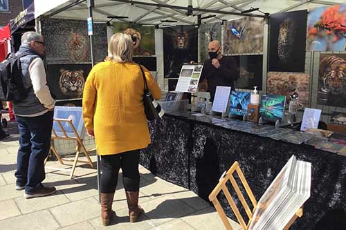 ashley vincent engaging with customers at the Christchurch spring market