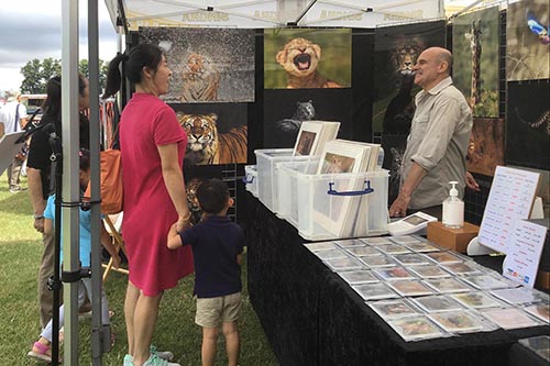 ashley vincent engaging with customers at the Cambridge Thai Festival