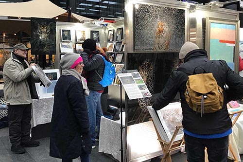 Ashley Vincent engaging with customers at the December 2022 Spitalfields Arts Market