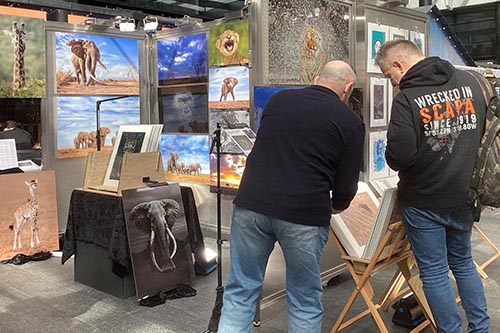 Ashley Vincent engaging with customers at the April 2024 Spitalfields Arts Market